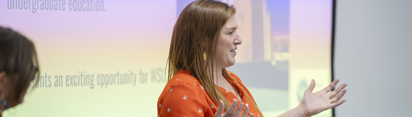  A woman presents to a class