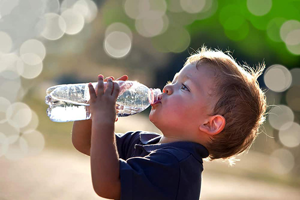 Little boy drinking water